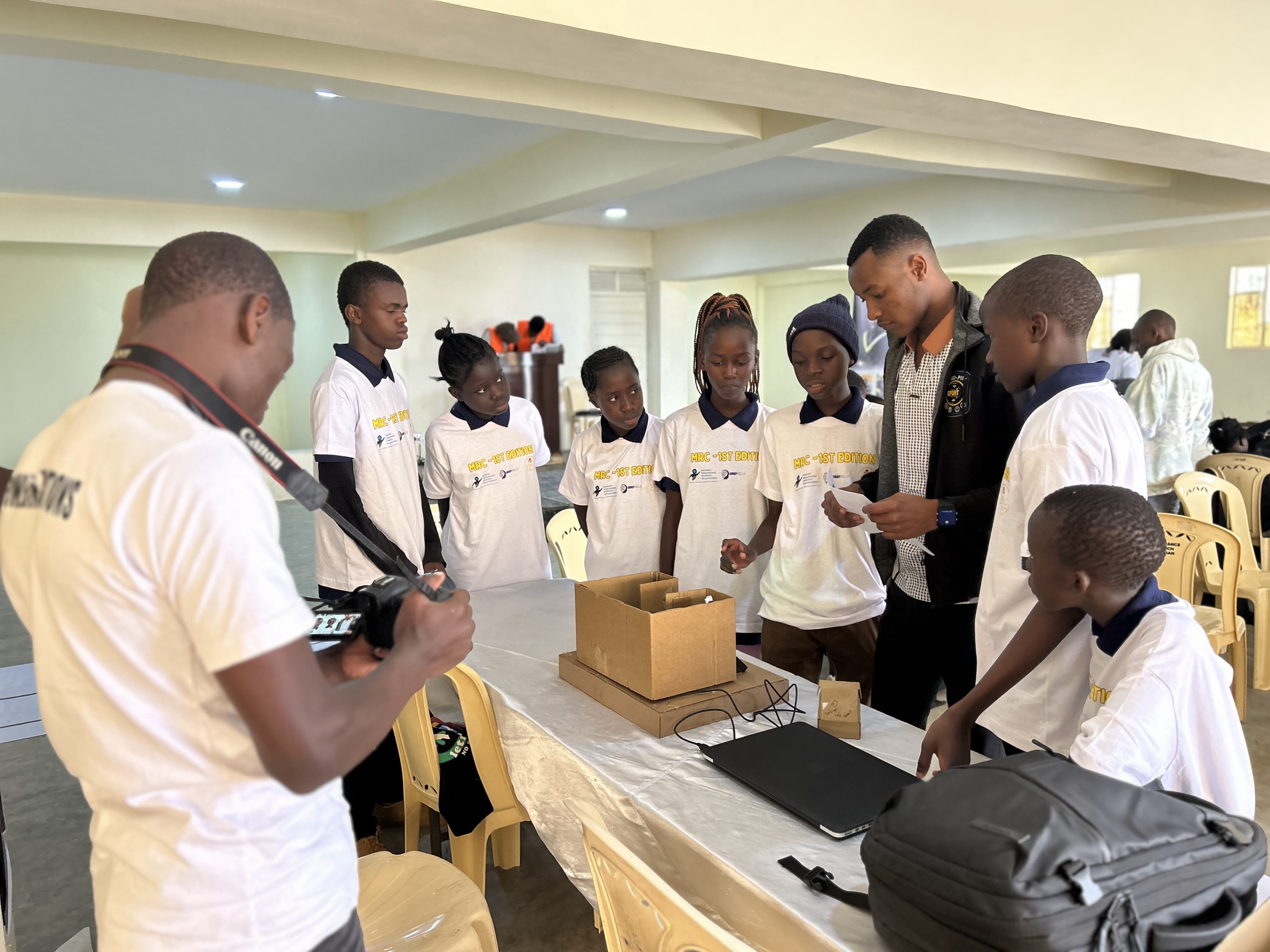 MRC Kenya team exhibiting a student engineering project