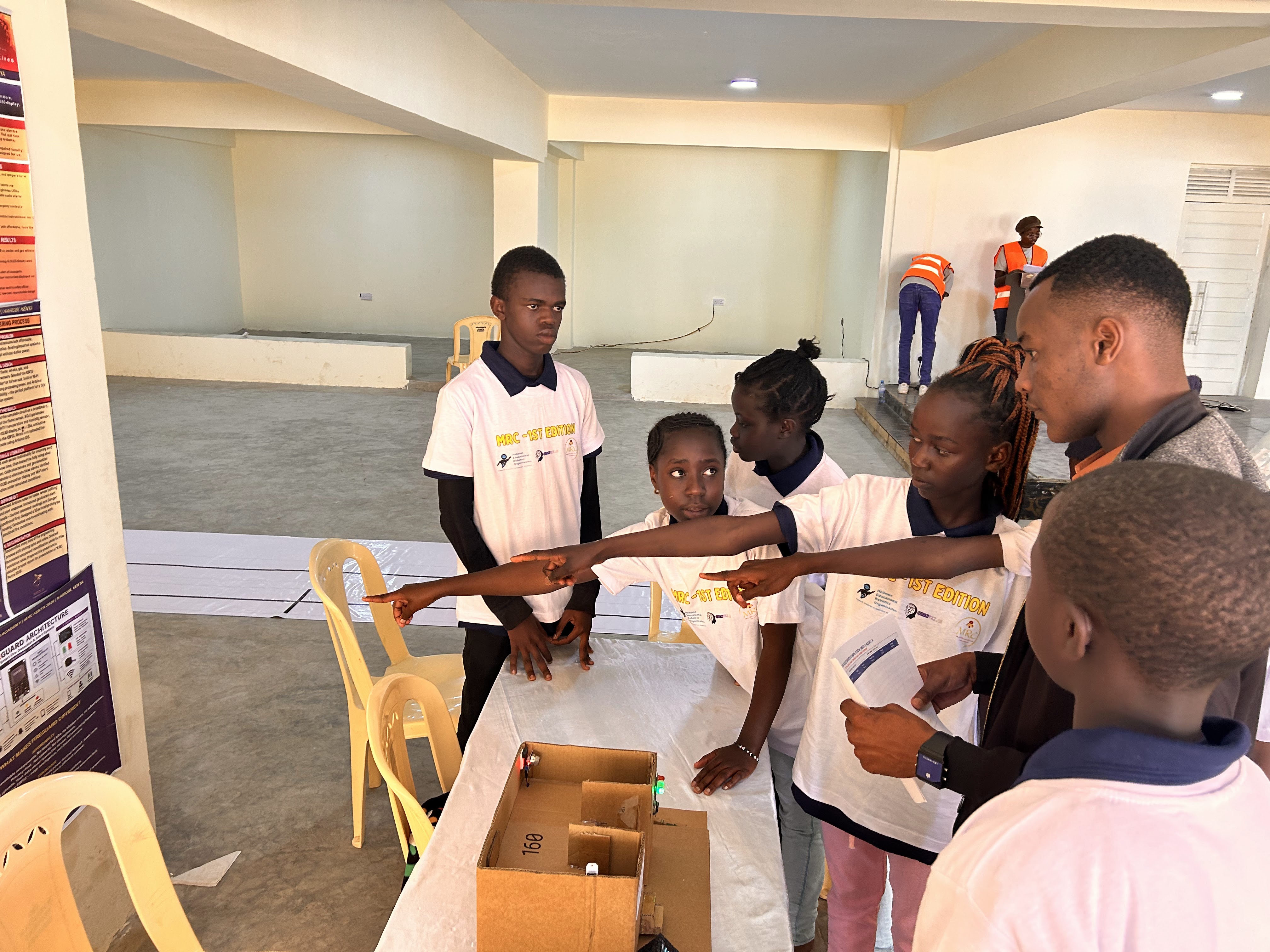 Students demonstrating a robot project during MRC Kenya