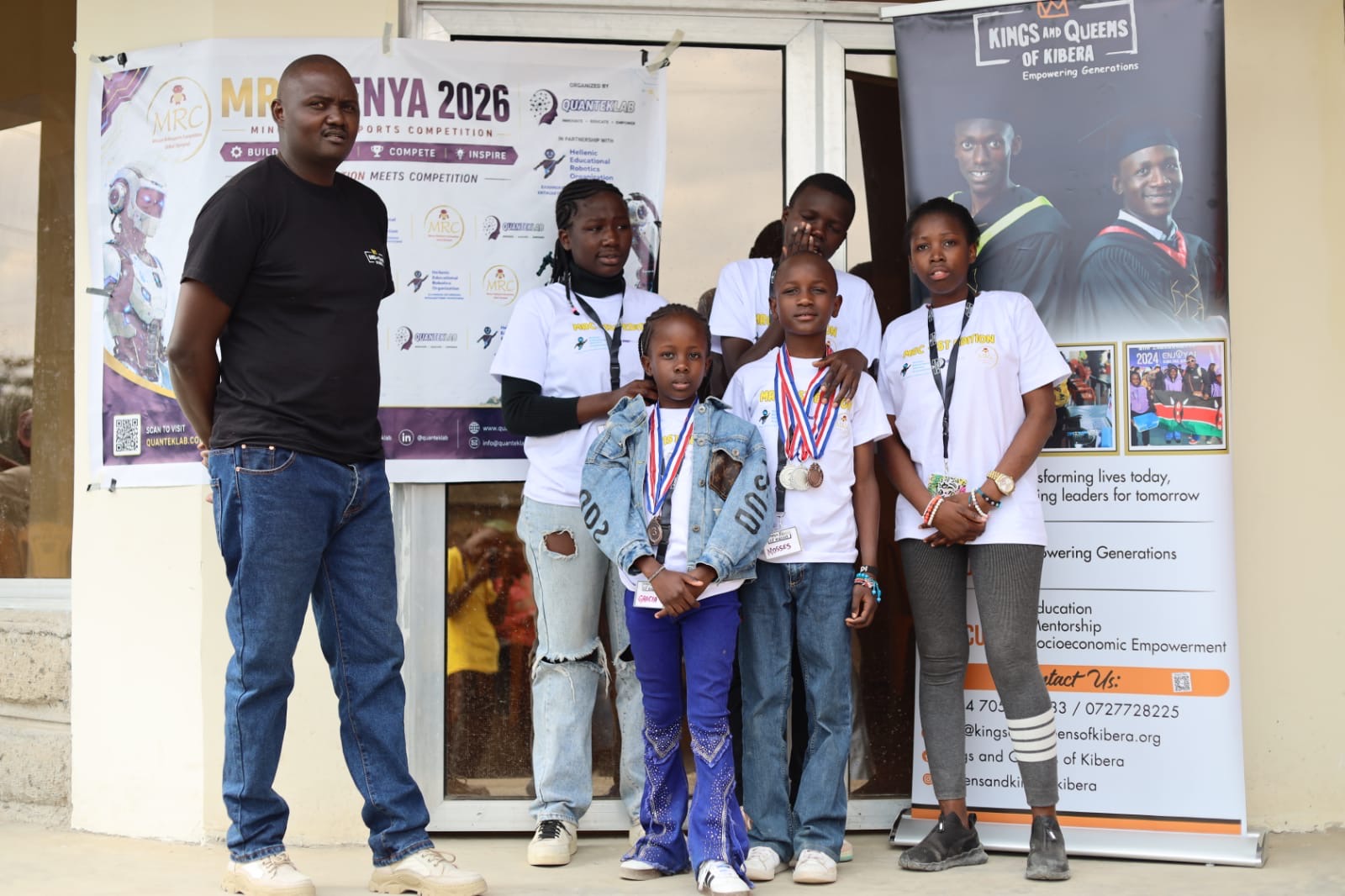 Medal winners with their mentors