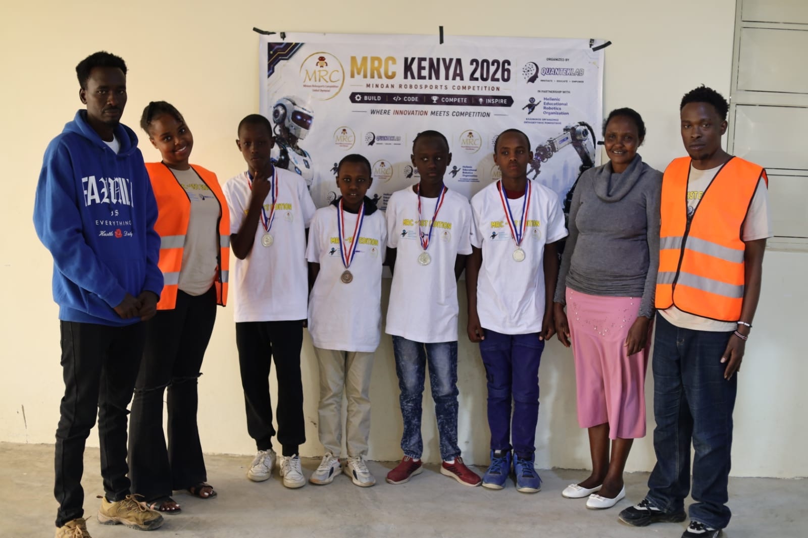 Award-winning MRC Kenya team with organizers after the competition
